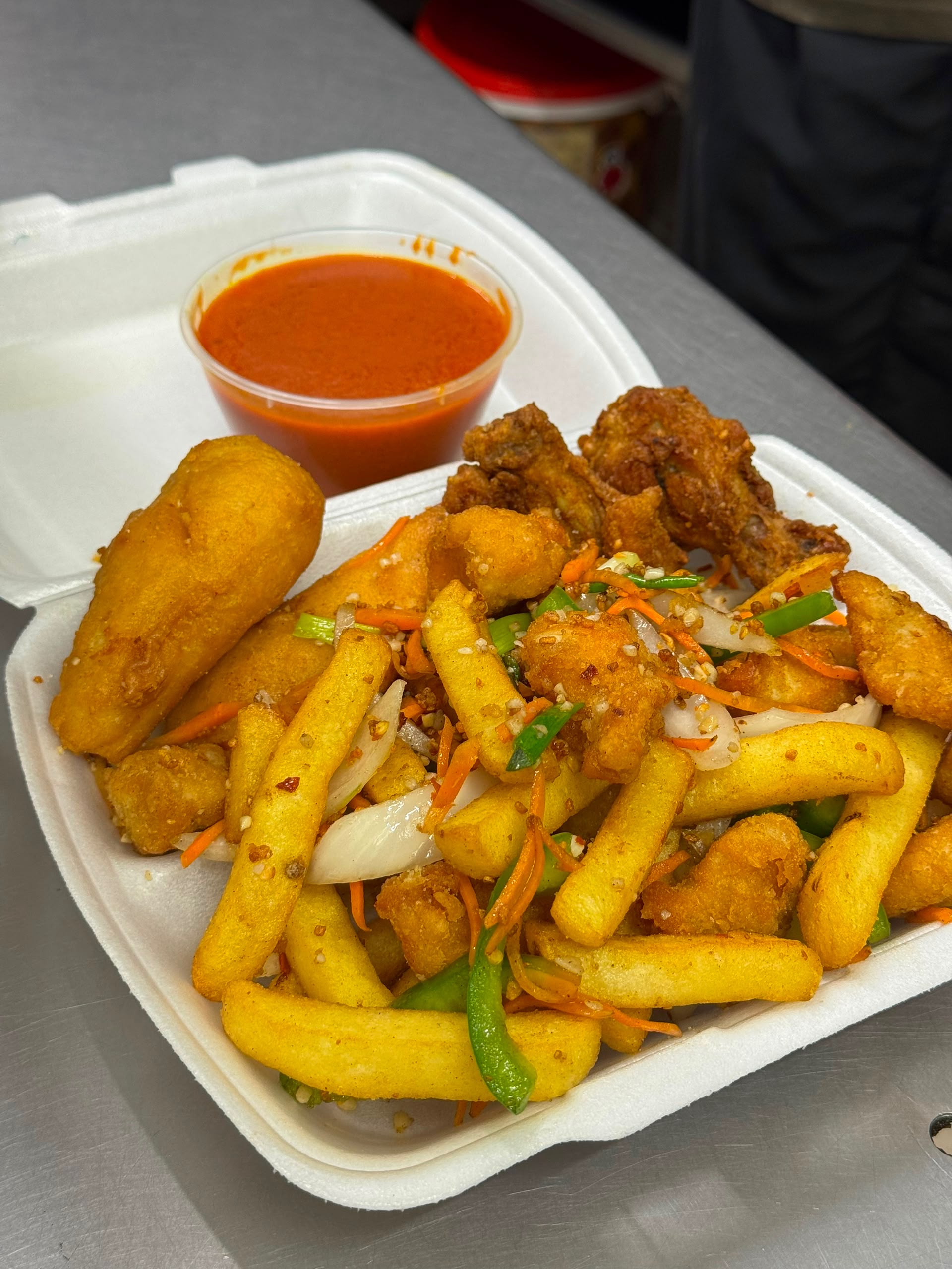 Salt and pepper chicken, chicken balls, wings and chips with curry sauce